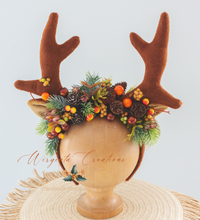 Load image into Gallery viewer, Handmade reindeer antler headband decorated with pinecones, frosted berries, and greenery, perfect for Christmas photoshoots, themed celebrations, and festive costumes.