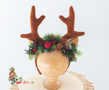 Load image into Gallery viewer, Handmade reindeer antler headband decorated with pinecones, frosted berries, and greenery, perfect for Christmas photoshoots, themed celebrations, and festive costumes.