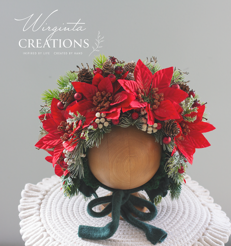 Poinsettias Christmas Flower bonnet for 9-24 months old, red and green colours, bonnet is placed on oval wooden stand, photography prop, creator - Wirginta Creations