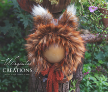 Load image into Gallery viewer, Burnt orange fox bonnet decorated with faux fur on a wooden stand. Photography prop. Creator - Wirginta Creations. 