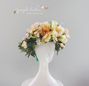 Large headpiece decorated with artificial flowers for adult. Beige, Cream and Green colour. Photography Crown