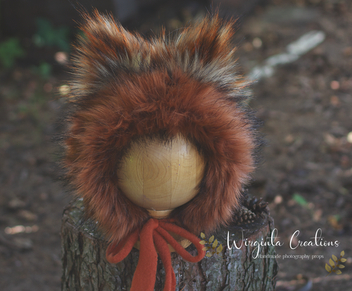 Handmade fox bonnet for 6-24 months old.  Burnt orange, tattered style decorated with faux fur.