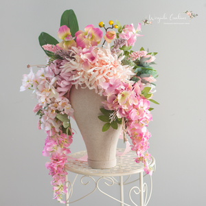 Large cascading headpiece decorated with artificial flowers for adult. Pink. Photography Crown