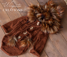 Load image into Gallery viewer, Knitted hooded fox romper for 9-18 months old. Photography prop, burnt orange colour. Hood decorated with faux fur. Romper placed on wooden background. Wirginta Creations - the creator