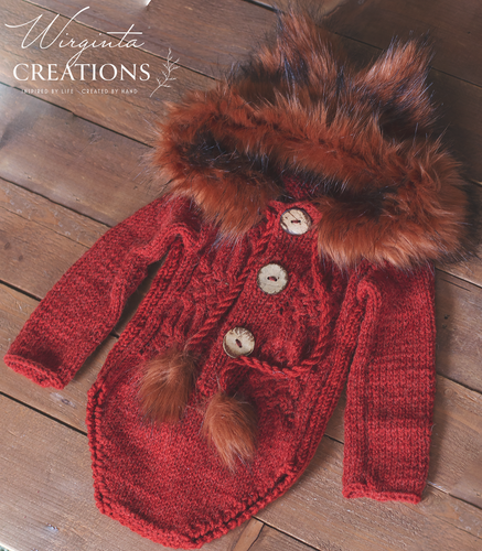 Knitted hooded fox romper for 9-18 months old. Photography prop, burnt orange colour. Hood decorated with faux fur. Romper placed on wooden background. Wirginta Creations - the creator
