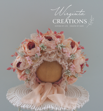 Load image into Gallery viewer, Light peach peonies flower bonnet for 12-24 months old placed on a wooden oval stand. artificial flower headpiece. Brand: Wirginta Creations