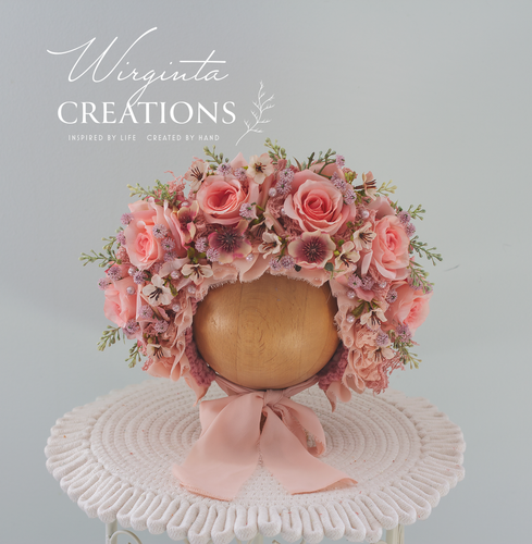 Pink flower bonnet for 6-24 months old. artificial roses flowers, bonnet placed on wooden ball stand. Brand: Wirginta Creations
