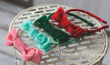 Load image into Gallery viewer, Four velour bows: mint, pink, dark green and sparkly red. plastic headbands for photography, photo prop, Bow headbands laid on metal surface. Wirginta Creations handmade photography prop, hair accessory