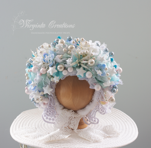 Light blue and white flower bonnet, Christmas theme, size 9-24 months old, photography prop. Bonnet placed on wooden ball