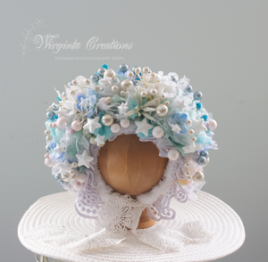 Light blue and white flower bonnet, Christmas theme, size 9-24 months old, photography prop. Bonnet placed on wooden ball