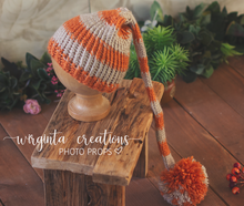 Load image into Gallery viewer, Handmade knitted bonnet for 6-12 months old. Long Pom pom hat for sitter. Burnt orange, grey. Ready to send