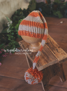 Handmade knitted bonnet for 6-12 months old. Long Pom pom hat for sitter. Burnt orange, grey. Ready to send